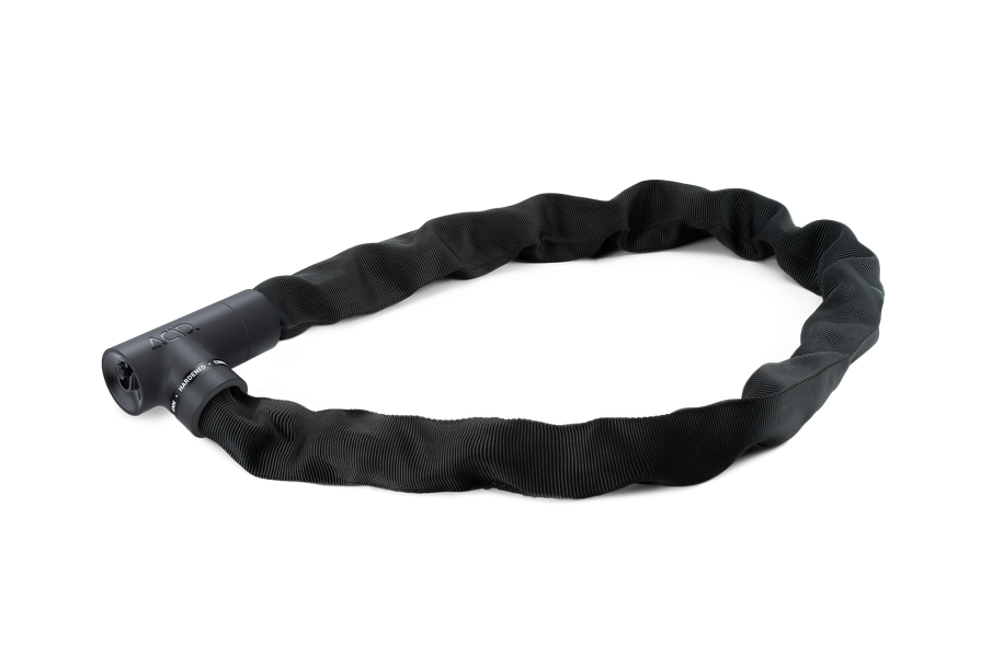 Das ACID Kettenschloss SOLID K120 von ACID mit korrosionsgeschützter Stoffhülle und zylindrischem GRIP+ Schloss wird in ovaler Form auf weißem Hintergrund dargestellt.