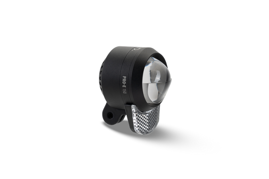 Das ACID E-Bike Frontlicht PRO-E 150 X-Connect von ACID ist ein schwarz-silbernes Frontlicht mit runder Linse, LED-Power und reflektierender Oberfläche darunter, abgebildet auf weißem Hintergrund.