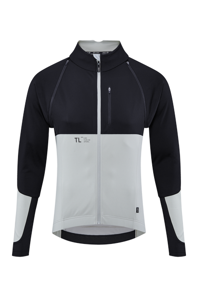 Die CUBE TEAMLINE Multifunktionsjacke black'n'grey von CUBE hat lange Ärmel, einen hohen Kragen mit Reißverschluss, ein schwarzes Oberteil und Ärmel, ein hellgraues Unterteil, wind- und wasserabweisendes Material, eine Brusttasche und ein minimalistisches Branding.